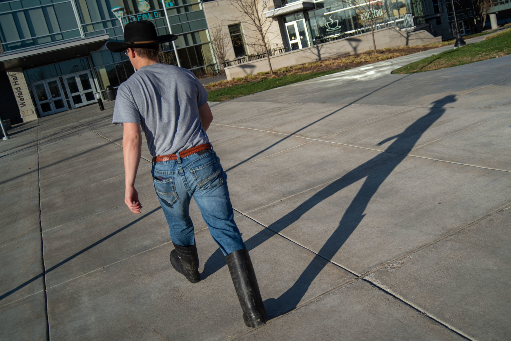 A K-State student walks into Wefald Hall during their move-out time slot on Friday.